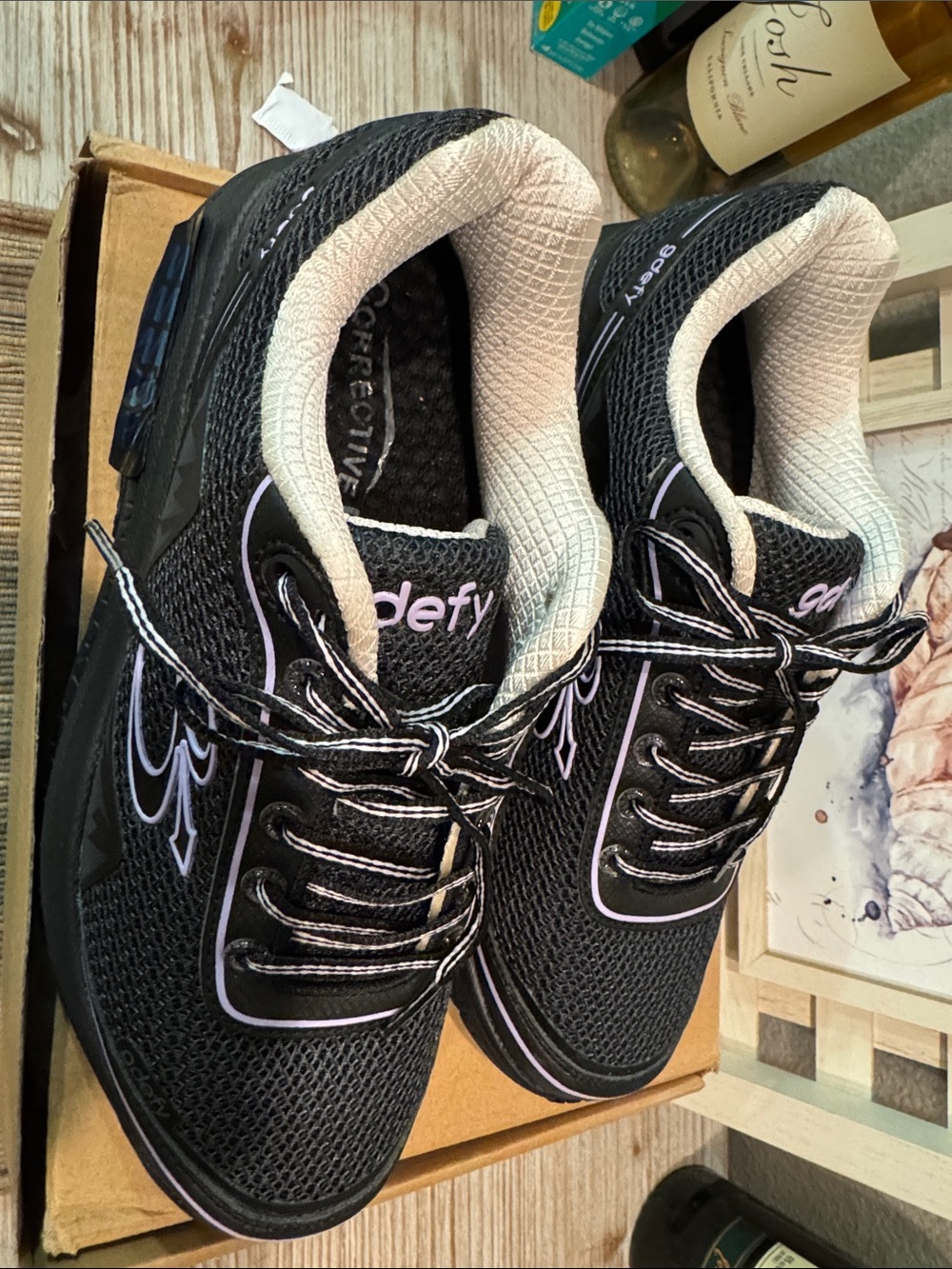 Defy Women's Black Sneakers with Light Purple Trim.